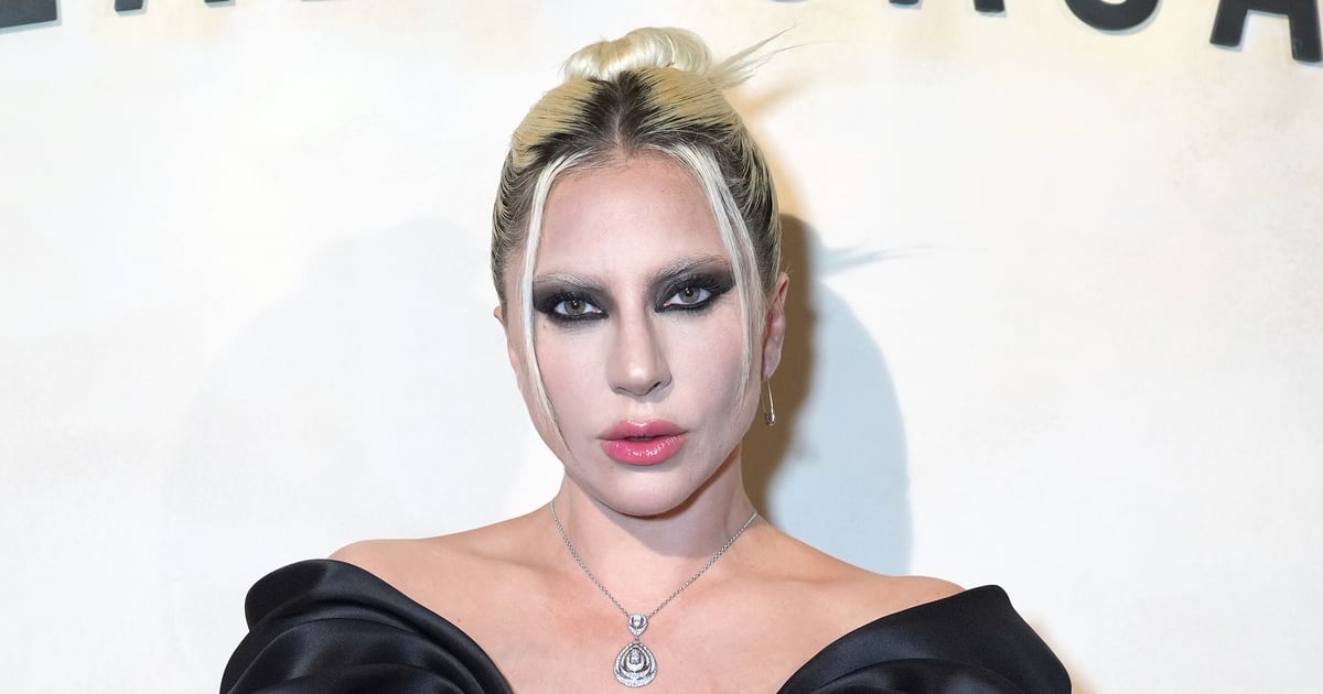 Vestido preto e meia arrastão de Lady Gaga no evento Dom Perignon